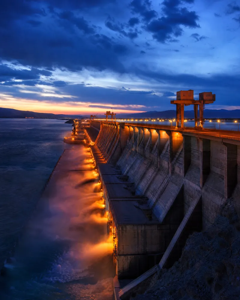 Massive dam infrastructure at twilight